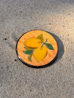 Italien wood coaster with lemons